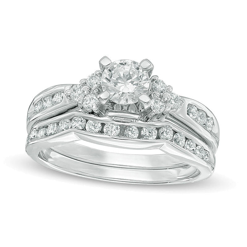 Brautset mit Diamanten 1.0 ct. Gesamtgewicht, rund, dreiseitig, in 10K Weißgold