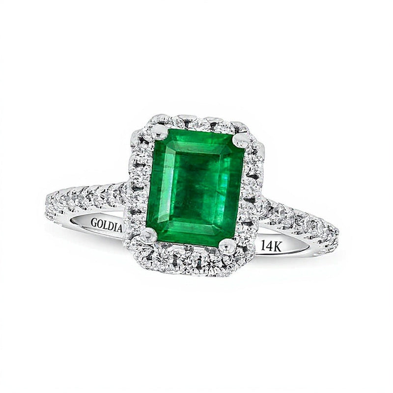 Verlobungsring mit Smaragd im Smaragdschliff und Diamanten 0,5 ct. Gesamtgewicht im Halo aus 14K Weißgold