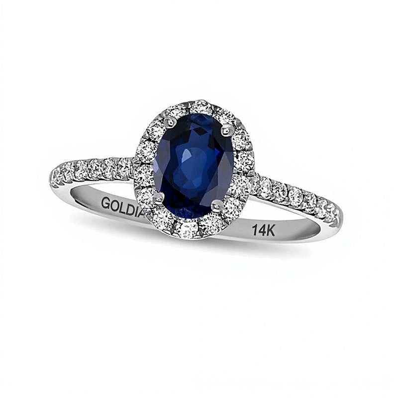 Verlobungsring mit ovalem blauem Saphir und Diamanten 0,38 ct. Gesamtgewicht als Halo in 14K Weißgold
