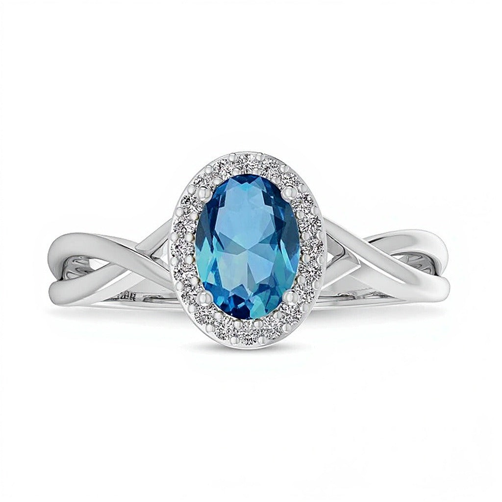 Ring mit ovalem Swiss Blue Topas und 0,07 ct. Gesamtgewicht Diamanten mit Rahmen und Crossover-Schiene in 10K Weißgold