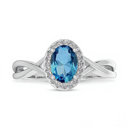 Ring mit ovalem Swiss Blue Topas und 0,07 ct. Gesamtgewicht Diamanten mit Rahmen und Crossover-Schiene in 10K Weißgold