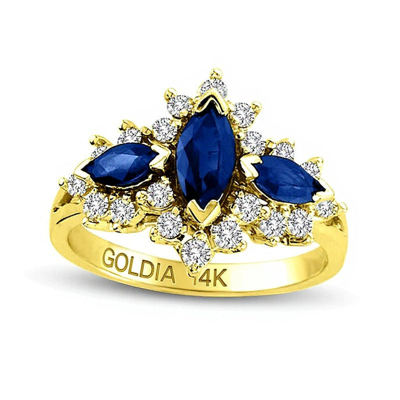 Dreistein-Ring mit blauem Saphir im Marquise-Schliff und 0.63 ct. Gesamtgewicht Diamanten in 14K Gelbgold