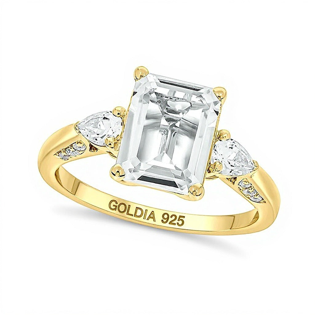 Ring mit weißem synthetischem Saphir im Smaragdschliff und Diamanten-Besatz 0,1 ct. Gesamtgewicht in Sterlingsilber und 14K Gold