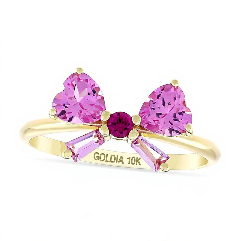 Fashion-Ring in Schleifenform mit Rubin und Saphir in Herz-, Baguette- und Rundschliff aus 10K Gelbgold