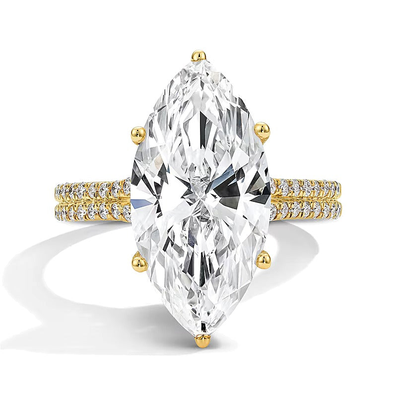 6.5 ct. Gesamtgewicht Solitär mit seitlichem Besatz mit Labordiamanten im Marquise- und Rundschliff in 14K Gelbgold (F/VS2)