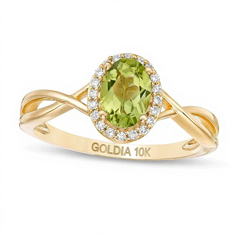 Ring mit ovalem Peridot und 0,07 ct. Gesamtgewicht Diamanten mit Rahmen und gedrehter Ringschiene in 10K Gelbgold