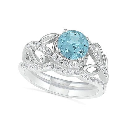 7,0 mm Aquamarin und 0,38 ct. Gesamtgewicht Diamant Bypass Brautset mit Blattdesign-Ringschiene in 10K Weißgold