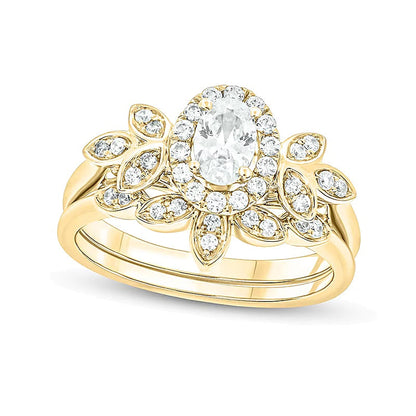 0,75 ct. Gesamtgewicht Brautset mit ovalem Diamant, Halo und blattförmigem seitlichem Besatz in 14K Gelbgold (I/I2)