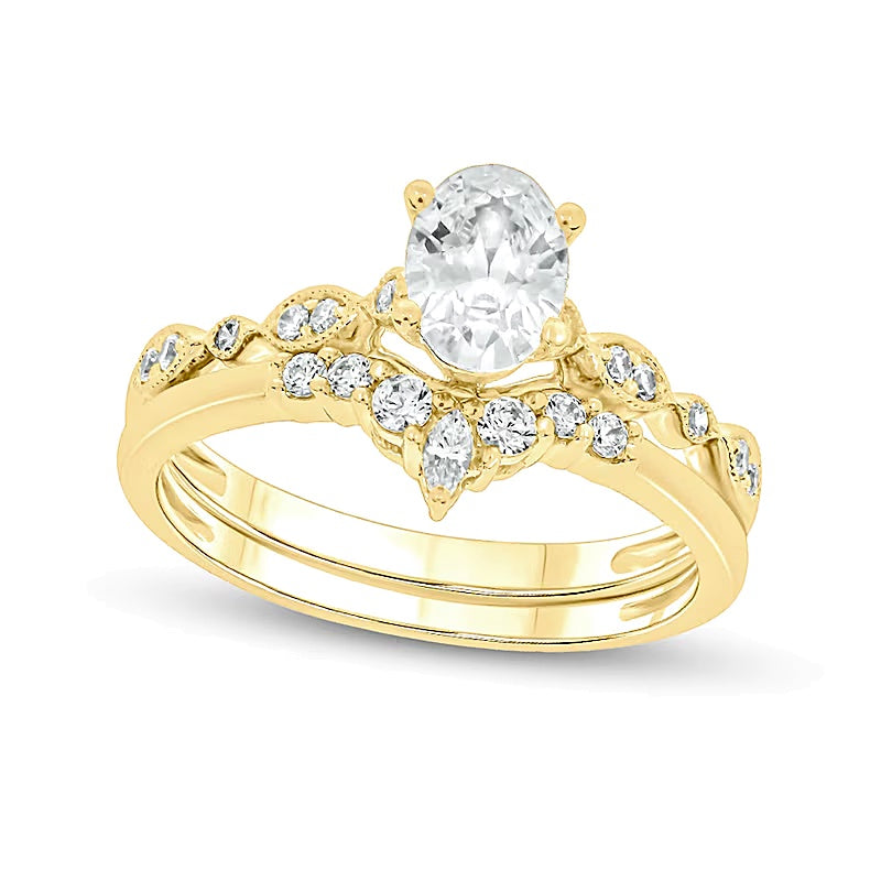 0,75 ct. Gesamtgewicht Brautset mit Diamanten in Oval- und Rundschliff in 14K Gelbgold (I/I2)