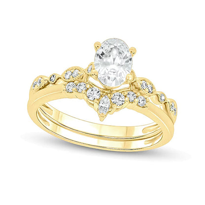0,75 ct. Gesamtgewicht Brautset mit Diamanten in Oval- und Rundschliff in 14K Gelbgold (I/I2)