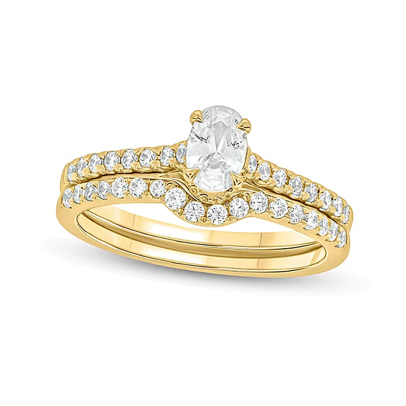 1.0 CT. Gesamtgewicht Brautset mit ovalem Diamant in 14K Gelbgold (I/I2)