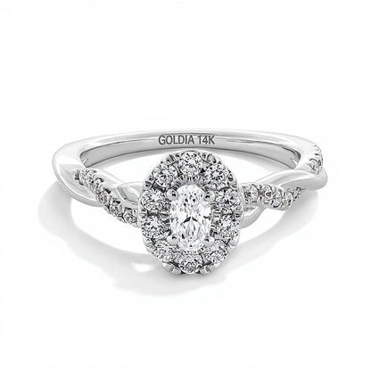 Verlobungsring 0,75 ct. Gesamtgewicht mit ovalem Diamant und Halo, gedrehte Ringschiene, in 14K Weißgold