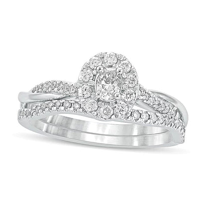 Brautset mit ovalem Diamant 0.5 CT. Gesamtgewicht und gedrehter Ringschiene in 10K Weißgold