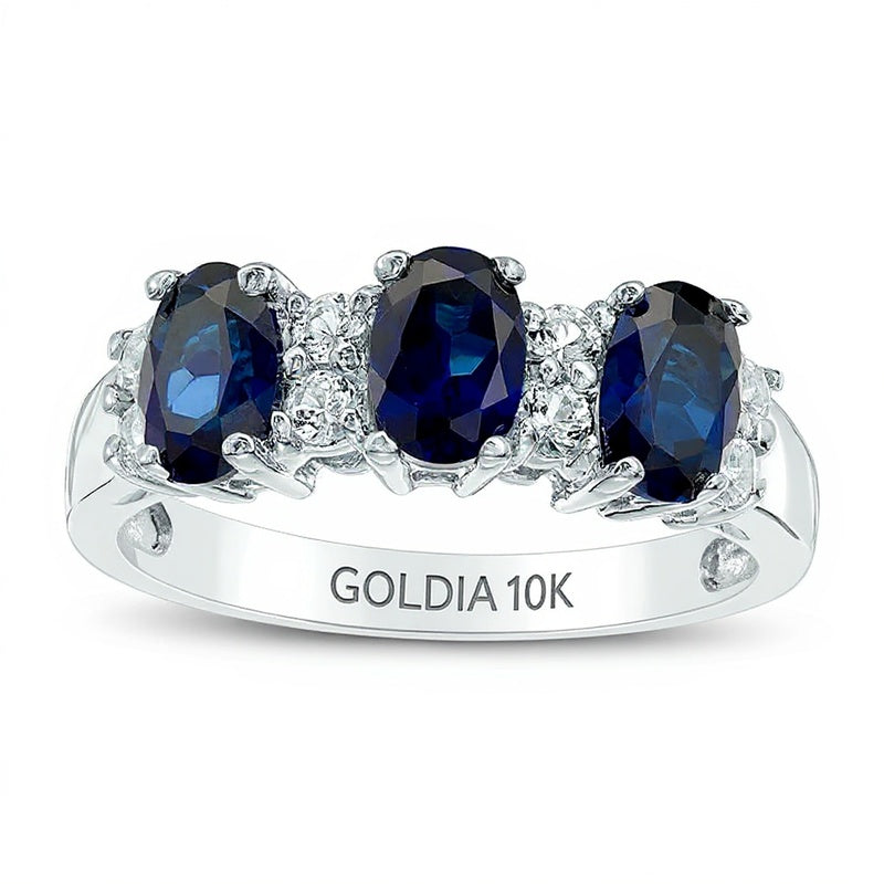 Dreistein-Ring mit ovalem blauem und rundem weißem Saphir (Labor) in 10K Weißgold