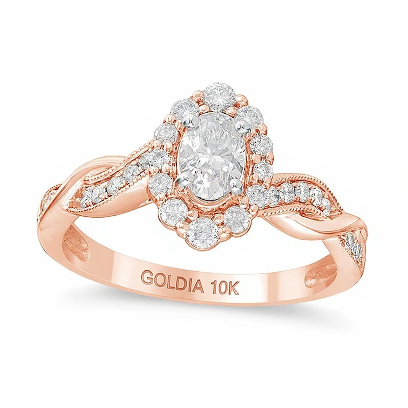 0,75 ct. Gesamtgewicht Verlobungsring im Vintage-Stil mit ovalem Diamanten, Halo und gedrehter Ringschiene in 10K Roségold