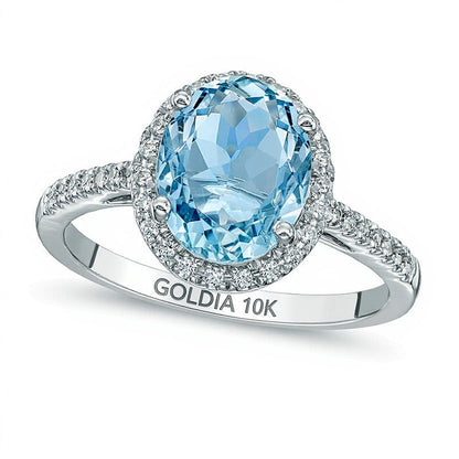 Verlobungsring mit ovalem Aquamarin und 0,2 ct. Gesamtgewicht Diamanten im Halo aus 10K Weißgold