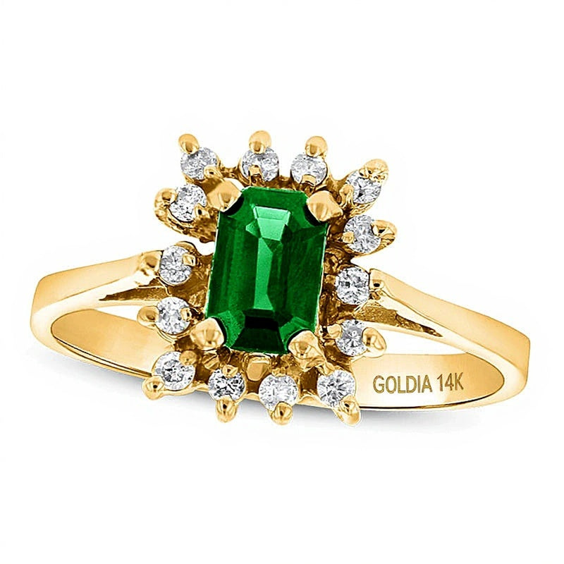 Halo-Ring mit Smaragd im Smaragdschliff und 0,13 ct. Gesamtgewicht Diamanten in 14K Gelbgold