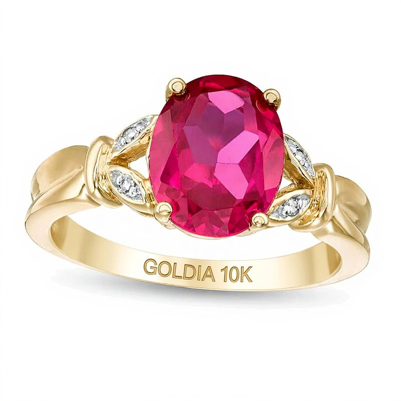 Fashion Ring mit ovalem Labor-Rubin und Diamant-Besatz in Blattoptik und geteilter Schiene in 10K Gelbgold