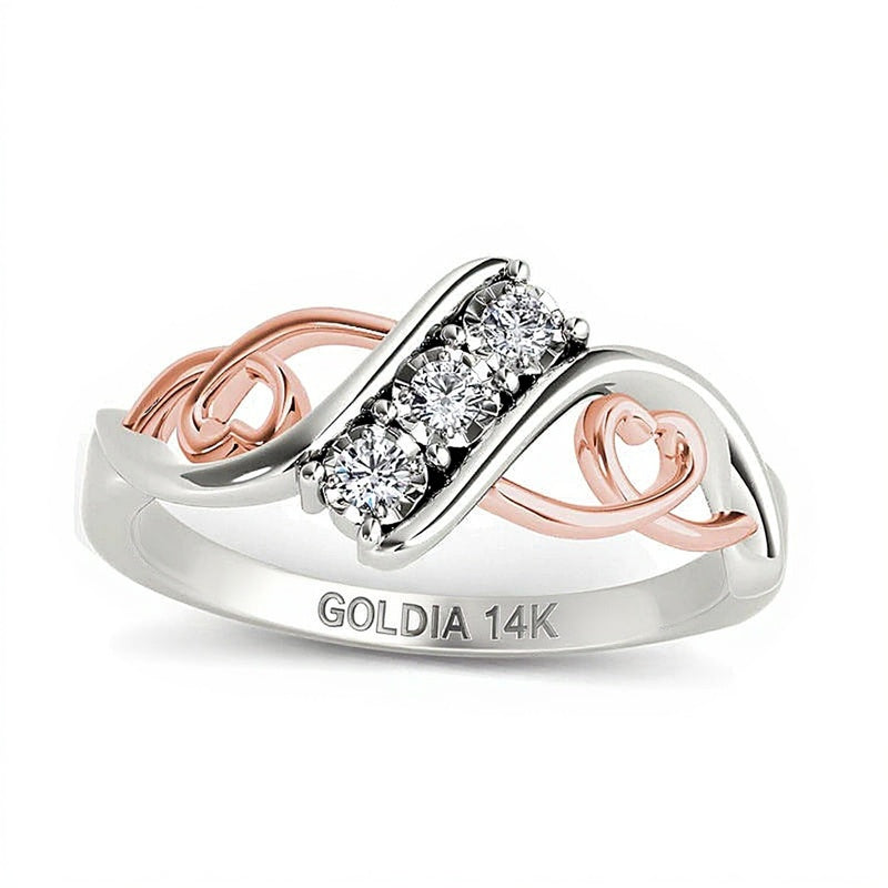 Dreistein-Ring mit Bypass und Herzen mit Diamanten 0.1 CT. Gesamtgewicht in 14K Weißgold und Roségold-Rhodium