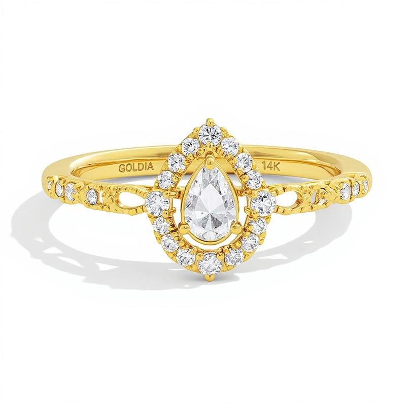 0.5 ct. Gesamtgewicht Halo-Verlobungsring mit tropfenförmigem Diamant in 14K Gelbgold (I/I1)