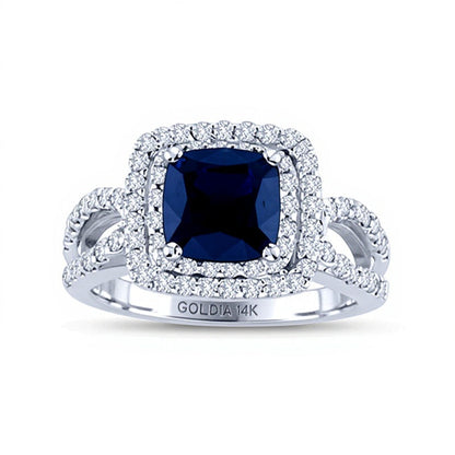Verlobungsring Halo mit blauem Saphir im Kissenschliff 6,5 mm und 0,75 ct. Gesamtgewicht Diamanten in 14K Weißgold