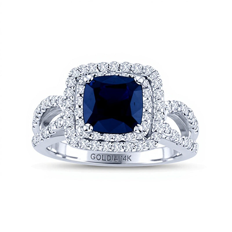Verlobungsring Halo mit blauem Saphir im Kissenschliff 6,5 mm und 0,75 ct. Gesamtgewicht Diamanten in 14K Weißgold