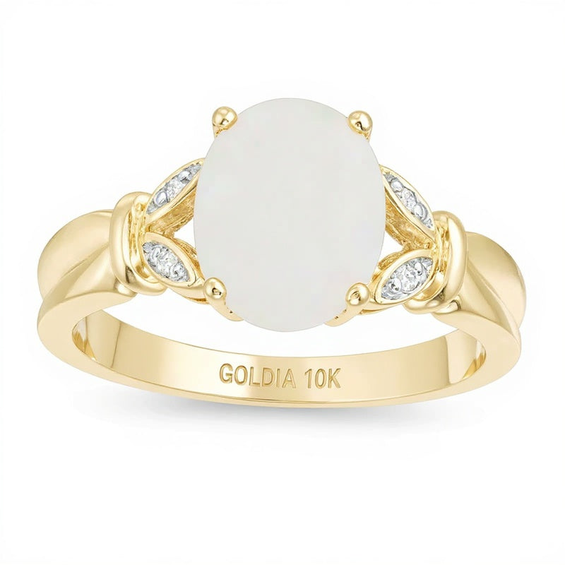 Fashion-Ring mit ovalem Labor-Opal und Diamant-Besatz in Blattoptik mit geteiltem Ring-Schaft in 10K Gelbgold
