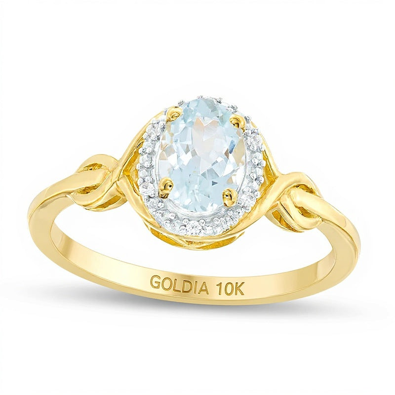 Ring mit ovalem Aquamarin und Diamantbesatz in 10K Gelbgold