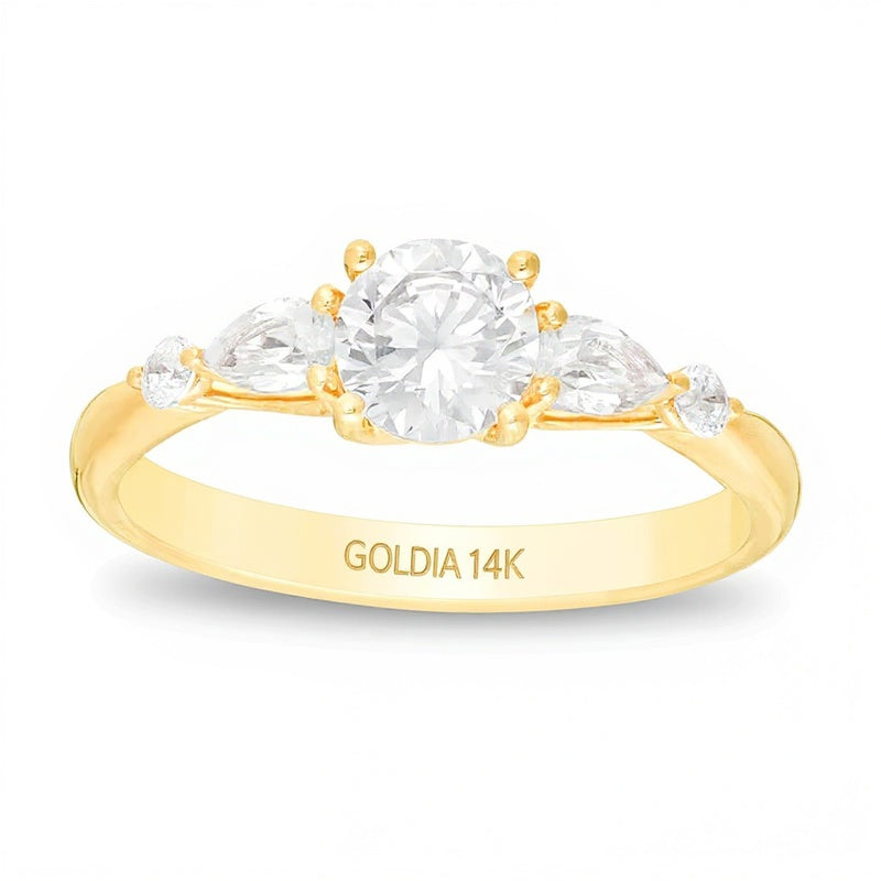 Solitär mit seitlichem Besatz mit rundem und tropfenförmigem Diamant 1.0 CT. Gesamtgewicht in 14K Gelbgold