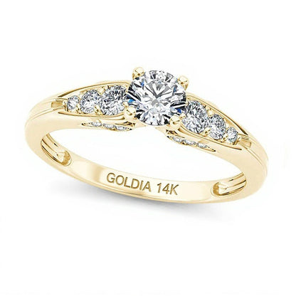 Solitär-Verlobungsring mit seitlichem Besatz mit weißen runden Diamanten, 0,63 ct. Gesamtgewicht, in 14K Gelbgold