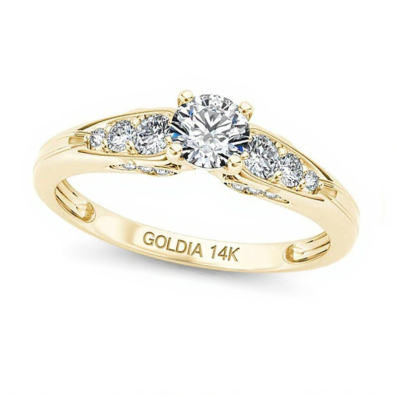 Solitär-Verlobungsring mit seitlichem Besatz mit weißen runden Diamanten, 0,63 ct. Gesamtgewicht, in 14K Gelbgold