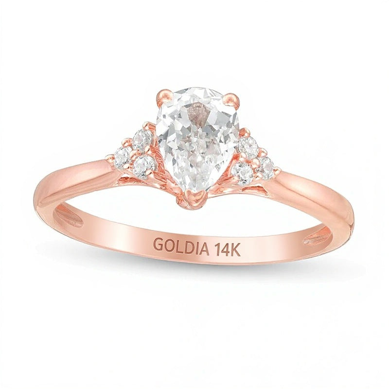 0,63 ct. Gesamtgewicht Solitär mit seitlichem Besatz mit Diamanten in Tropfen- und Rundschliff in 14K Roségold