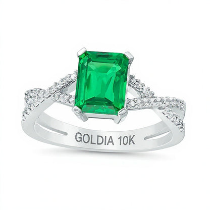 Ring mit Smaragd im Smaragdschliff (Labor) und 0,1 ct. Gesamtgewicht Diamanten mit Criss-Cross-Split-Shank in 10K Weißgold
