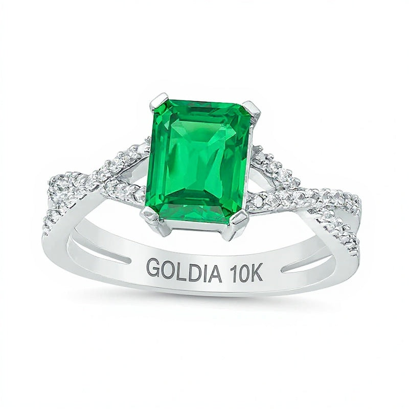 Ring mit Smaragd im Smaragdschliff (Labor) und 0,1 ct. Gesamtgewicht Diamanten mit Criss-Cross-Split-Shank in 10K Weißgold