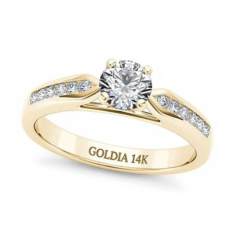 0.63 ct. Gesamtgewicht Diamant-Verlobungsring als Solitär mit seitlichem Besatz in 14K Gelbgold