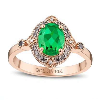 Halo-Ring mit ovalem Labor-Smaragd und 0,07 ct. Gesamtgewicht behandelten schwarzen und weißen Diamanten in 10K Roségold