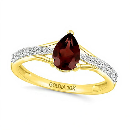 Fashion-Ring mit Granat im Tropfenschliff und weißen Labor-Saphiren rund in 10K Gelbgold