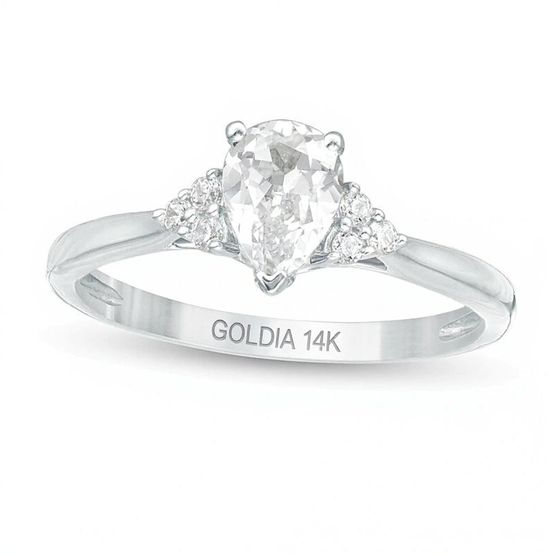 0,63 ct. Gesamtgewicht Solitär mit seitlichem Besatz mit tropfenförmigem und rundem Diamant in 14K Weißgold