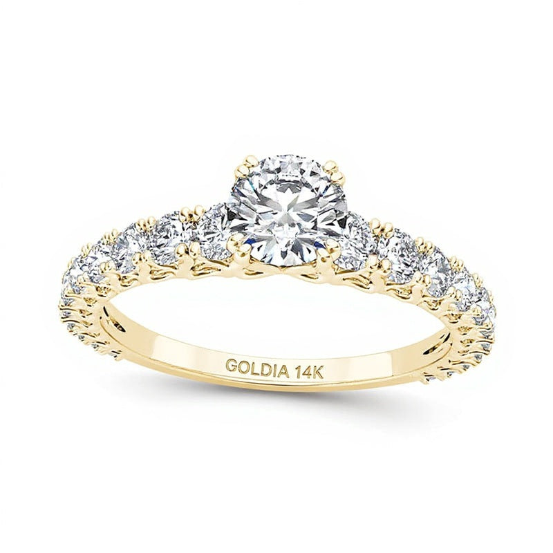 Solitär-Verlobungsring mit seitlichem Besatz mit weißen Diamanten im Rundschliff 1.0 ct. Gesamtgewicht in 14K Gelbgold