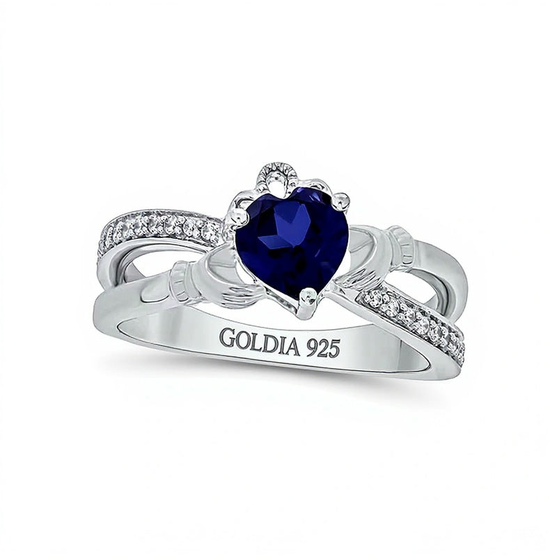 Claddagh-Ring für Damen mit herzförmigem blauem Labor-Saphir 5,0 mm und Diamanten 0,1 ct. Gesamtgewicht in rhodiniertem Sterlingsilber