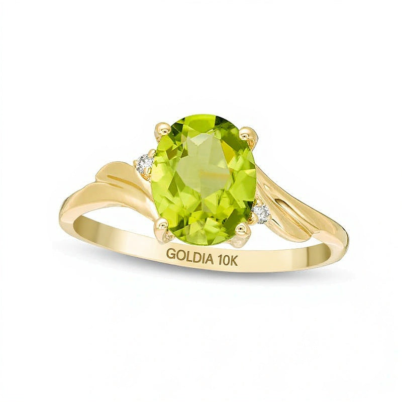 Ring mit ovalem Peridot und Diamantbesatz, Bypass-Design mit geschwungenem Ringband, Solitär mit seitlichem Besatz, aus 10K Gelbgold