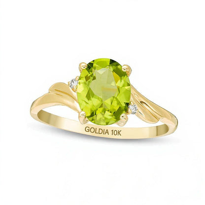 Ring mit ovalem Peridot und Diamantbesatz, Bypass-Design mit geschwungenem Ringband, Solitär mit seitlichem Besatz, aus 10K Gelbgold
