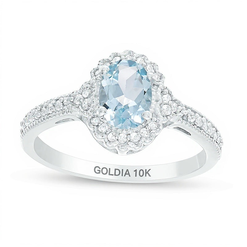 Halo-Ring mit ovalem Aquamarin und Diamanten 0,13 ct. Gesamtgewicht im Vintage-Stil in 10K Weißgold