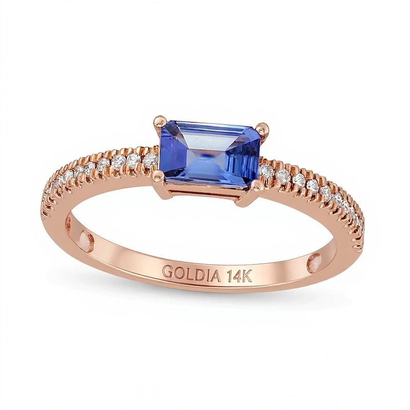 Solitär mit seitlichem Besatz mit Tansanit im Smaragdschliff und 0,1 ct. Gesamtgewicht Diamanten in 14K Roségold