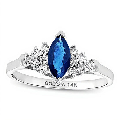 Solitär mit seitlichem Besatz mit blauem Saphir im Marquise-Schliff und Diamanten 0,2 ct. Gesamtgewicht in 14K Weißgold