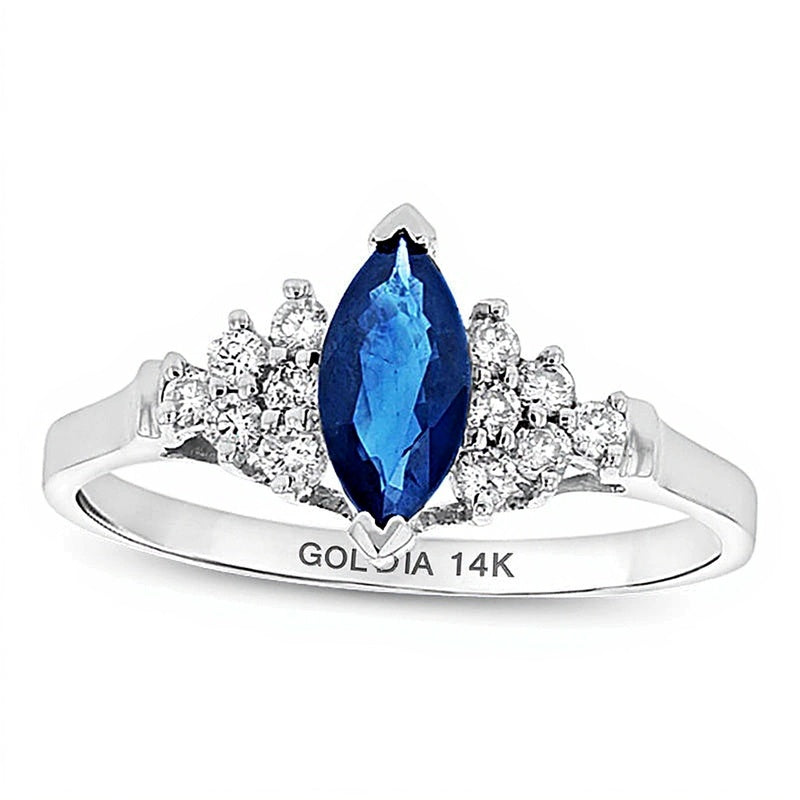 Solitär mit seitlichem Besatz mit blauem Saphir im Marquise-Schliff und Diamanten 0,2 ct. Gesamtgewicht in 14K Weißgold