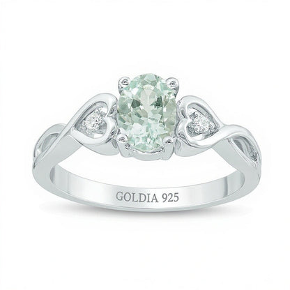 Freundschaftsring für Damen mit ovalem Aquamarin und Diamant-Besatz sowie Herzseiten aus rhodiniertem Sterlingsilber