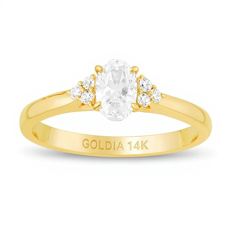 0.63 ct. Gesamtgewicht Verlobungsring mit ovalem Diamant und seitlichem Besatz in 14K Gelbgold