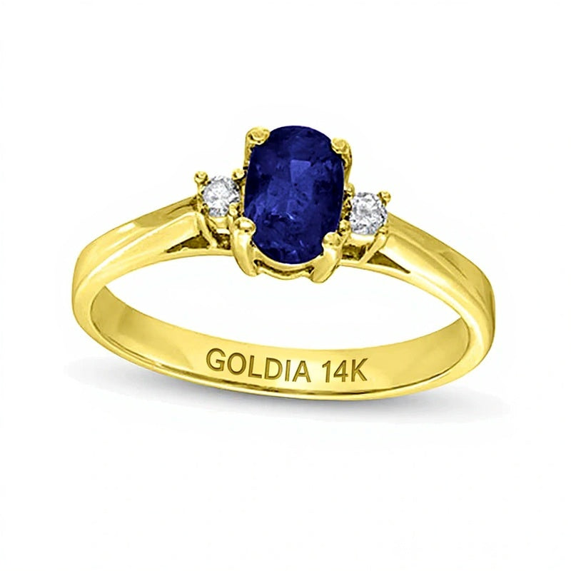 Ring mit ovalem blauem Saphir und 0,05 ct. Gesamtgewicht Diamanten in 14K Gelbgold