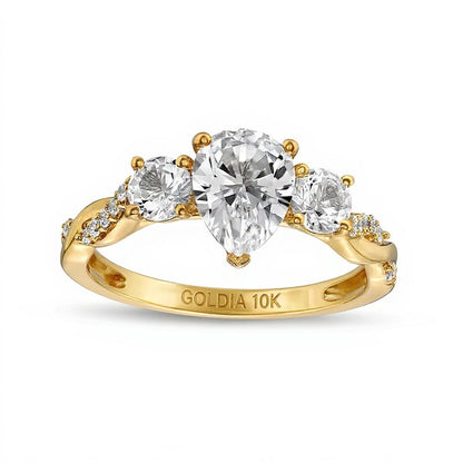 Dreistein-Ring für Damen mit tropfenförmigem weißem Labor-Saphir und 0,1 ct. Gesamtgewicht Diamanten in 10K Gelbgold
